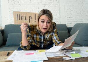 Portrait Of Stressed And Overwhelmed Young Woman Trying To Manag