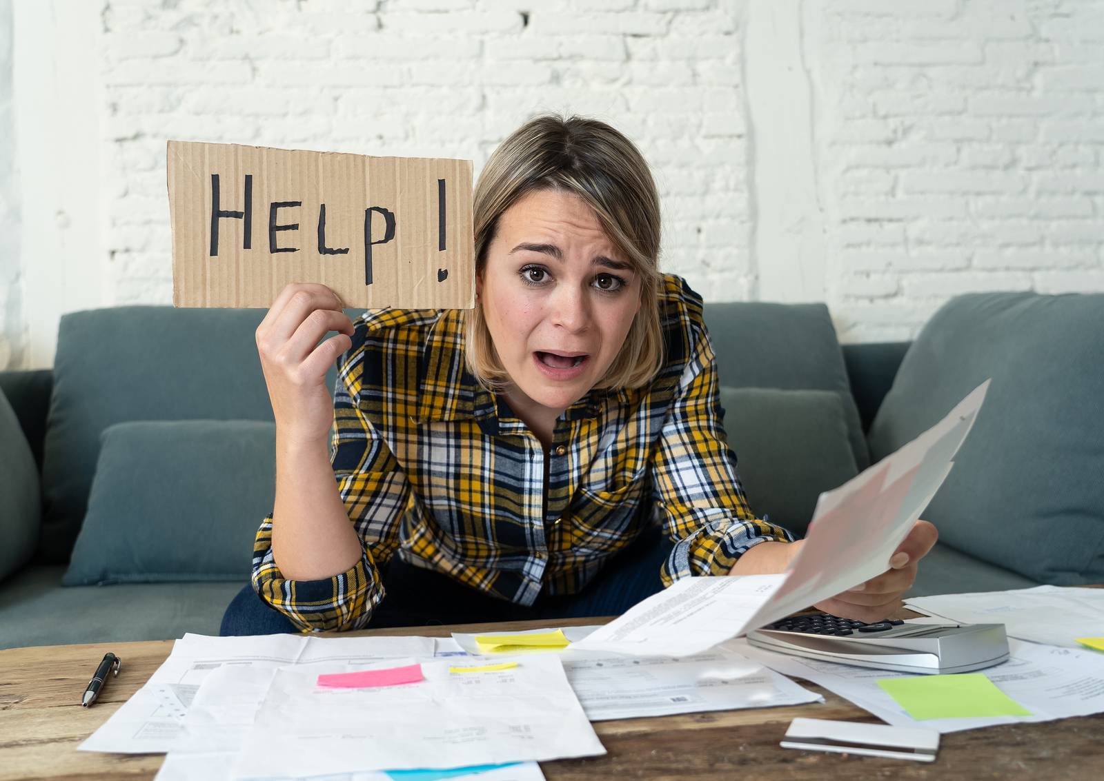 Portrait Of Stressed And Overwhelmed Young Woman Trying To Manag